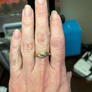 Women’s 10Ct gold and diamond accent ring.